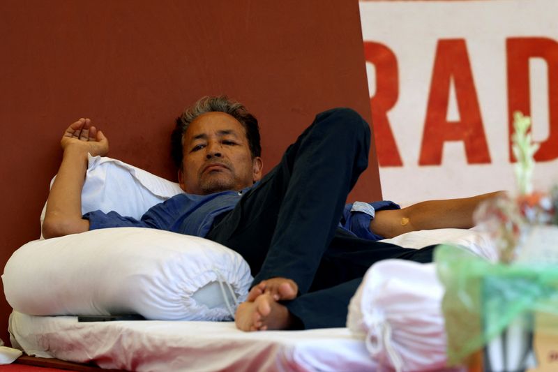 Sonam Wangchuk, an Indian education reformer, who has been on hunger strike, rests on stage during a sit-in protest called by CJP demanding the resignation of Indian Education Minister Dharmendra Pradhan, at Jantar Mantar in New Delhi, India, July 14, 2026. REUTERS/Bhawika Chhabra