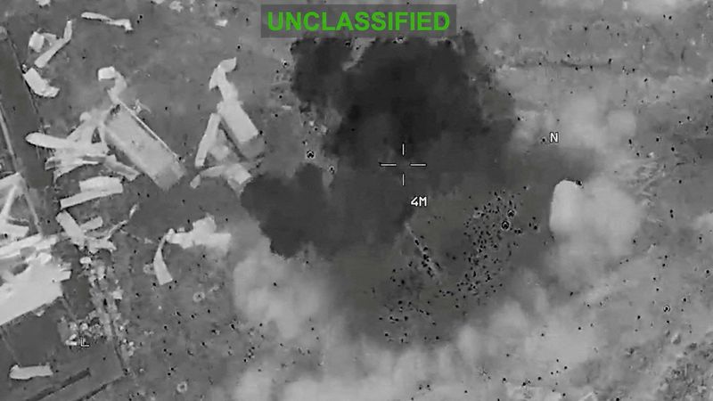 Scattered debris and smoke, at an unknown location, during what the U.S. Central Command (CENTCOM) says are strikes on Iran, in this screengrab taken from a handout video released on July 22, 2026.  U.S. Central Command/Handout via REUTERS