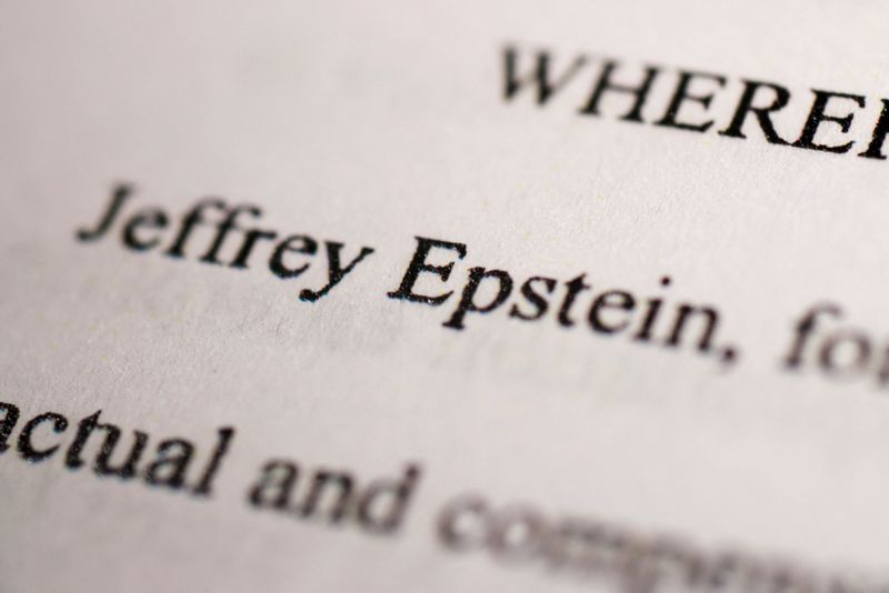 Newly-released documents from disgraced late financier and sex offender Jeffrey Epstein, referencing court cases against him, are seen in this handout released by the U.S. Justice Department and printed and arranged for a photograph by Reuters in Washington, D.C., U.S., December 19, 2025. REUTERS/Jonathan Ernst