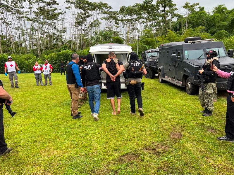 Authorities of Costa Rica's Judicial Investigation Agency (OIJ) escort Alejandro Arias, known as "El Diablo," the Central American country's most wanted fugitive and a suspect sought by the United States on drug trafficking charges, in Alajuela, Costa Rica, in this handout image distributed on July 24, 2026. Judicial Investigation Agency (OIJ)/Handout via REUTERS