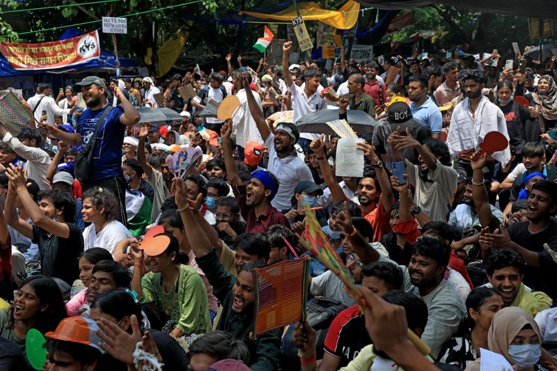 Supporters of India's Cockroach Janta Party (CJP) shout slogans during the ongoing protest, days after thousands of protesters marched towards parliament demanding the resignation of Education Minister Dharmendra Pradhan over National Eligibility cum Entrance Test (NEET) examination paper leaks, at Jantar Mantar in New Delhi, July 25, 2026. REUTERS/Bhawika Chhabra