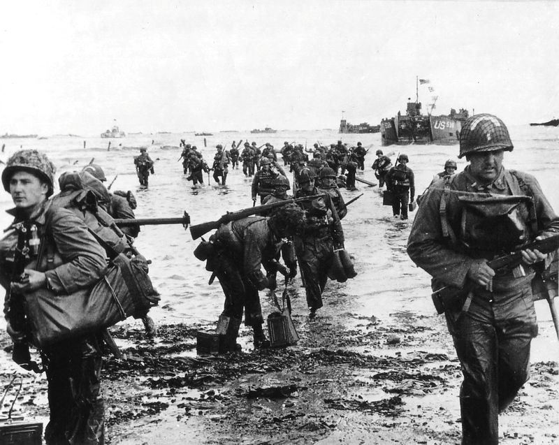 FILE PHOTO: U.S. reinforcements land on Omaha beach during the Normandy D-Day landings near Vierville sur Mer, France, on June 6, 1944 in this handout photo provided by the U.S. National Archives. Cpt Herman Wall/U.S. National Archives/Handout via Reuters/File Photo