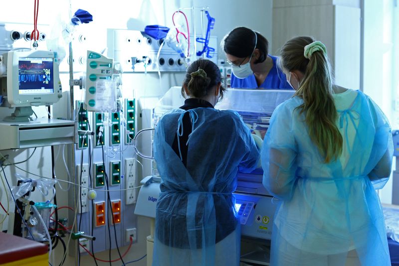 FILE PHOTO: Healthcare workers are seen at the pediatric intensiv care unit at the St. Joseph Hospital Tempelhof in Berlin, Germany December 5, 2022. REUTERS/Lisi Niesner/File Photo