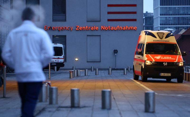 A healthcare worker walks towards the emergency department at Charite hospital in Berlin, Germany December 9, 2022. REUTERS/Lisi Niesner