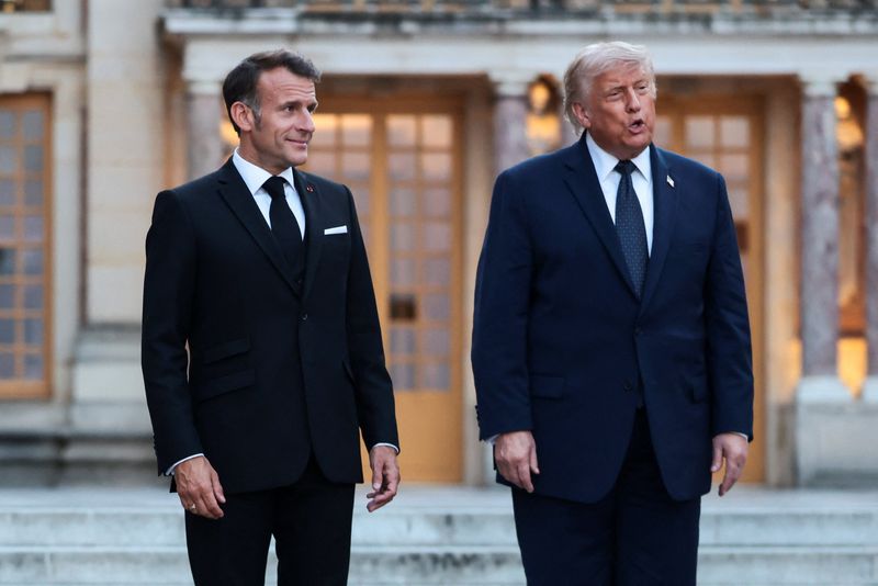 French President Emmanuel Macron welcomes U.S. President Donald Trump for a dinner commemorating the 250th anniversary of the United States' independence, at the Palace of Versailles, near Paris, France, June 17, 2026. REUTERS/Evelyn Hockstein/File Photo