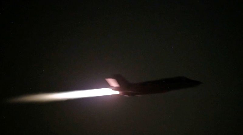 FILE PHOTO: A U.S. military aircraft flies at an unknown location, during what U.S. Central Command (CENTCOM) says are strikes on Iran, in this screengrab taken from a handout video released on July 20, 2026. U.S. Central Command/Handout via REUTERS/File Photo