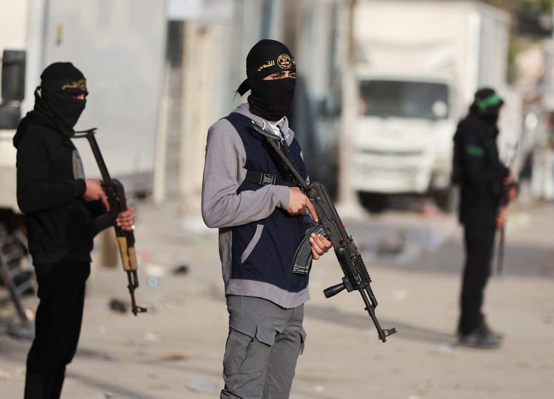 Militants from Hamas and Palestinian Islamic Jihad stand on a street during Eid al-Fitr in Gaza City, March 20, 2026. REUTERS/Dawoud Abu Alkas