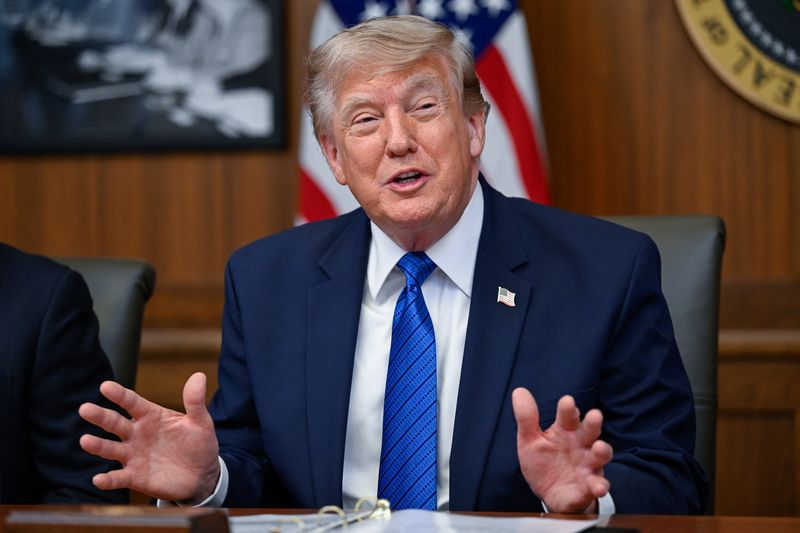 U.S. President Donald Trump gestures as he participates in a cabinet meeting at Camp David in Thurmont, Maryland, U.S., July 31, 2026. REUTERS/Daniel Heuer