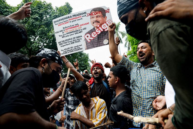 FILE PHOTO: Supporters of India's Cockroach Janta Party (CJP) celebrate after India's Education Minister Dharmendra Pradhan resigned following days of protests demanding his resignation over National Eligibility cum Entrance Test (NEET) examination paper leaks, in New Delhi, India, July 25, 2026. REUTERS/Adnan Abidi/File Photo