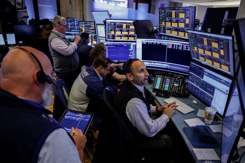 Traders work on the floor of the New York Stock Exchange (NYSE) in New York City, U.S., July 31, 2026. REUTERS/Jeenah Moon