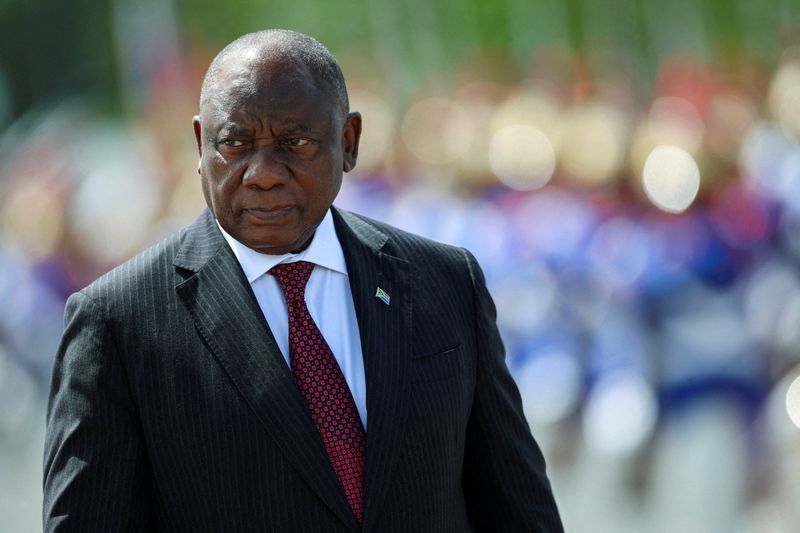 FILE PHOTO: South Africa's President Cyril Ramaphosa reviews the honour guard, on the day he meets Brazil's President Luiz Inacio Lula da Silva at Planalto Palace, in Brasilia, Brazil, March 9, 2026. REUTERS/Adriano Machado//File Photo