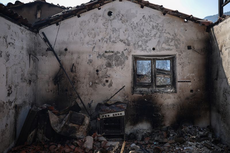 A view of a burned house in Psatha, Greece, August 4, 2026. REUTERS/Louisa Gouliamaki