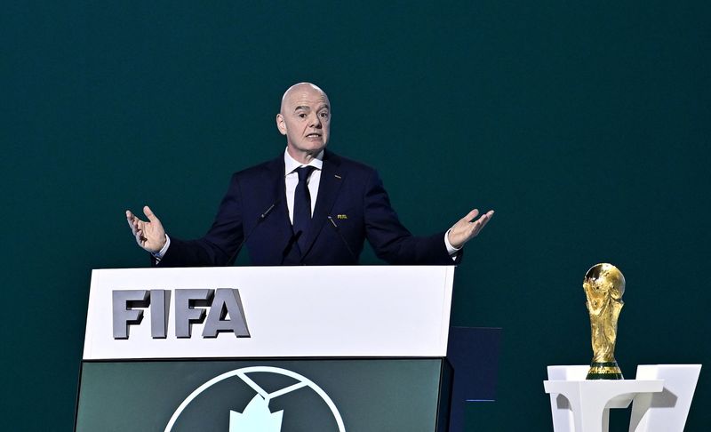 FILE PHOTO: Soccer Football - 76th FIFA Congress - Vancouver Convention Centre, Vancouver, Canada - April 30, 2026  FIFA President Gianni Infantino speaks during the congress as the FIFA World Cup Trophy is seen REUTERS/Jennifer Gauthier