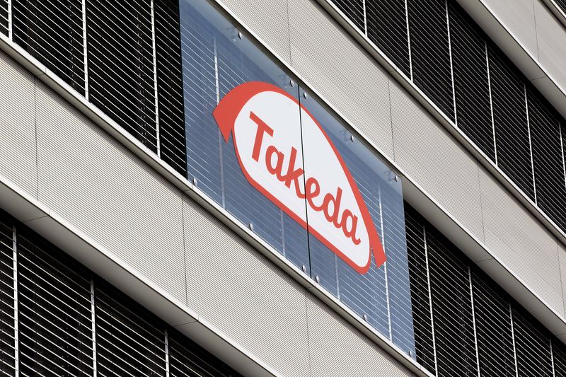 The logo of Japanese Takeda Pharmaceutical Co is seen at an office building in Glattbrugg near Zurich March 7, 2012.   REUTERS/Arnd Wiegmann (SWITZERLAND - Tags: BUSINESS HEALTH)