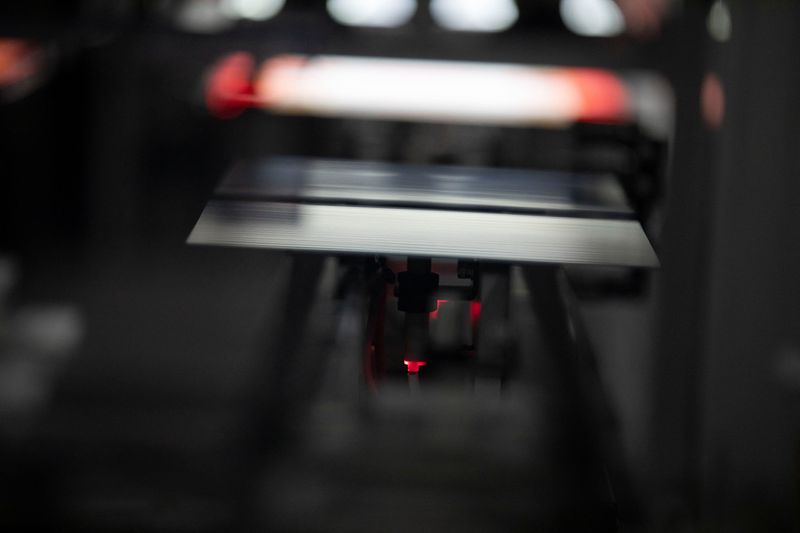 A solar cell moves through a machine inside the QCells North America factory in Cartersville, Georgia, U.S. June 8, 2026. REUTERS/Alyssa Pointer