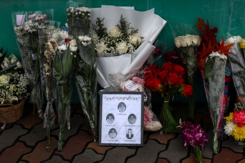 Flowers and pictures of teachers killed are left outside Debsirin Nonthaburi School following a deadly shooting at the school, in Bang Kruai district in Nonthaburi province, on the outskirts of Bangkok, Thailand, August 9, 2026. REUTERS/Valeria Mongelli