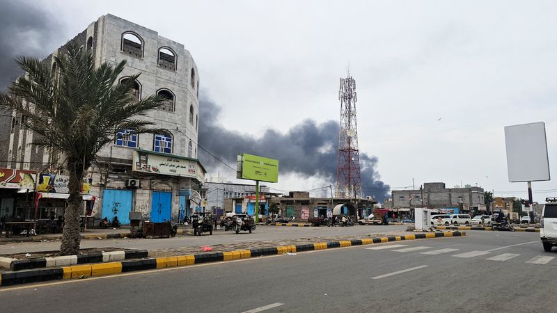 Smoke rises during Houthi missile and drone strikes on the Red Sea port city of Mocha, Yemen, August 9, 2026. Picture taken with a mobile phone. REUTERS/Stringer