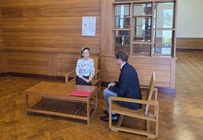 Myanmar's detained former leader Aung San Suu Kyi meets Myanmar's Resident Representative and Head of Delegation for the International Committee of the Red Cross (ICRC) Arnaude de Baecque, in Naypyidaw, Myanmar August 3, 2026. Khine Khine Soe, Myanmar Government spokesperson/Handout via REUTERS