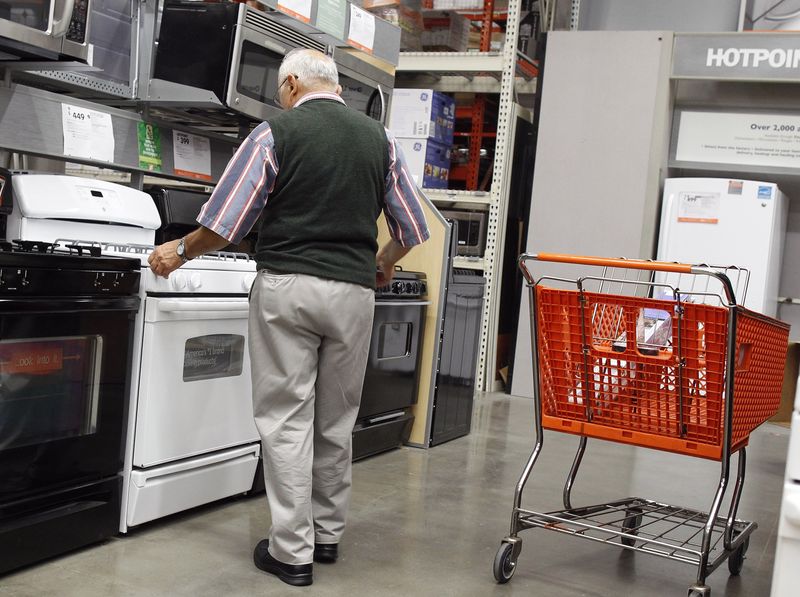 A man shops for an oven at a Home Depot store in New York July 29, 2010. REUTERS/Shannon Stapleton