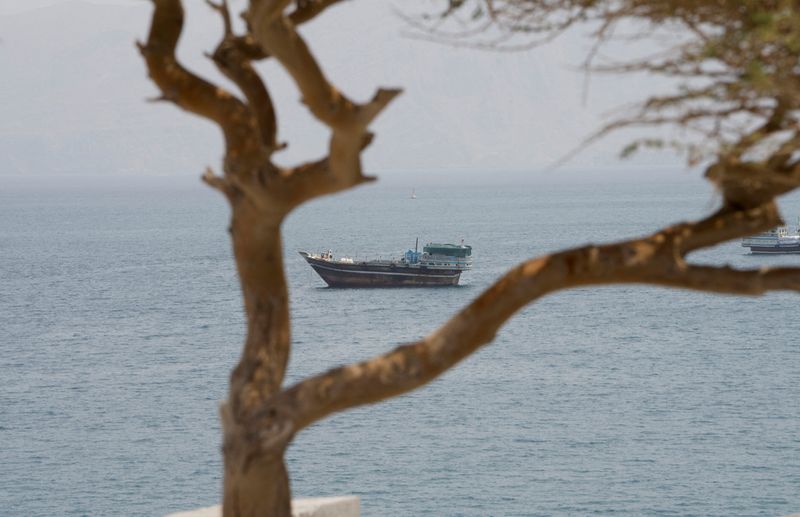 Vessels near the Strait of Hormuz, as seen from Musandam, Oman, August 10, 2026. REUTERS/Stringer