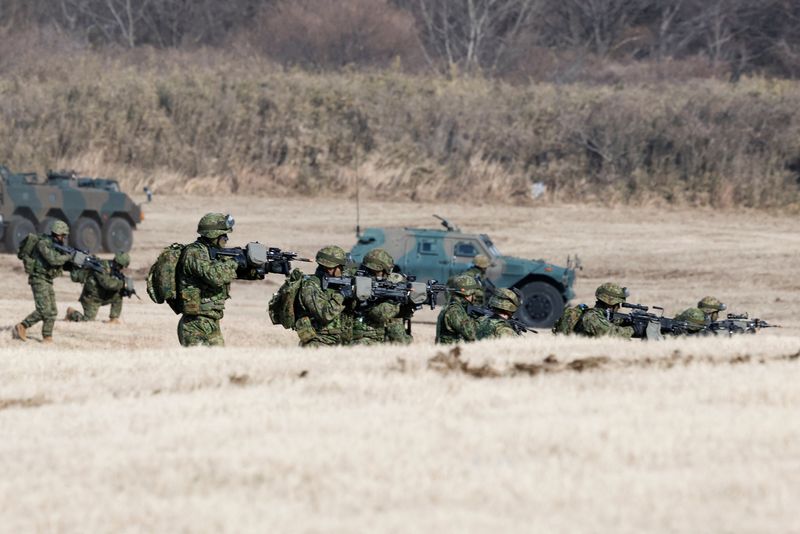FILE PHOTO: Military personnel take part in an annual New Year military drill by the Japanese Ground Self-Defense Force 1st Airborne Brigade at Narashino exercise field in Funabashi, east of Tokyo, Japan January 11, 2026. REUTERS/Kim Kyung-Hoon/File Photo