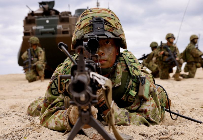 FILE PHOTO: Japanese Ground Self-Defense Force's Amphibious Rapid Deployment Brigade (ARDB) soldiers take part in a marine landing drill as a part of the country's nationwide 05JX military exercises at Tokunoshima island, Kagoshima prefecture, southwestern Japan November 19, 2023.  REUTERS/Issei Kato/File Photo