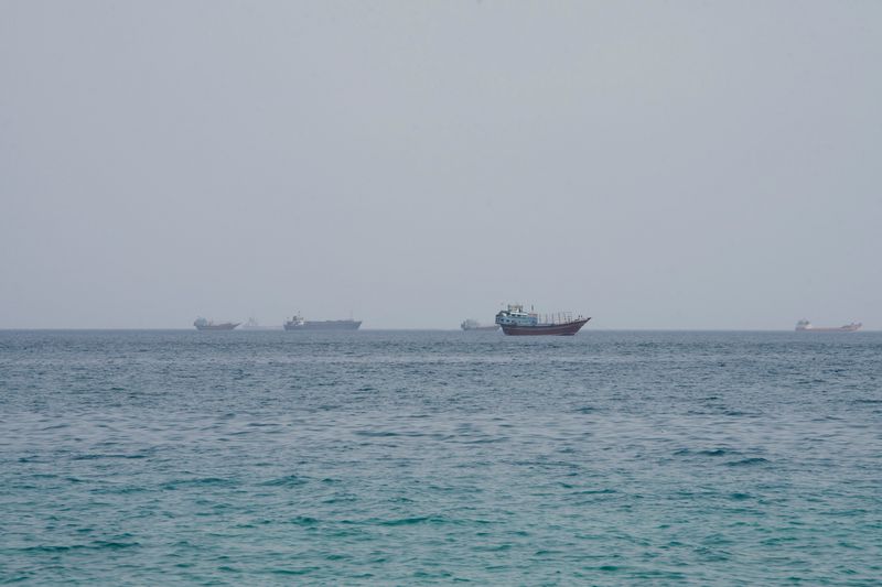 Vessels near the Strait of Hormuz, as seen from Musandam, Oman, August 10, 2026. REUTERS/Stringer