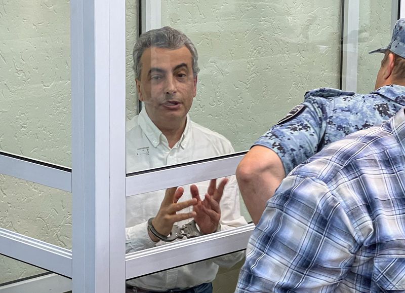 Yabloko party deputy chairman Lev Shlosberg, accused of discrediting Russia's armed forces and spreading false information about them, attends a court hearing in Pskov, Russia, August 17, 2026. REUTERS/Dmitry Vasilyev
