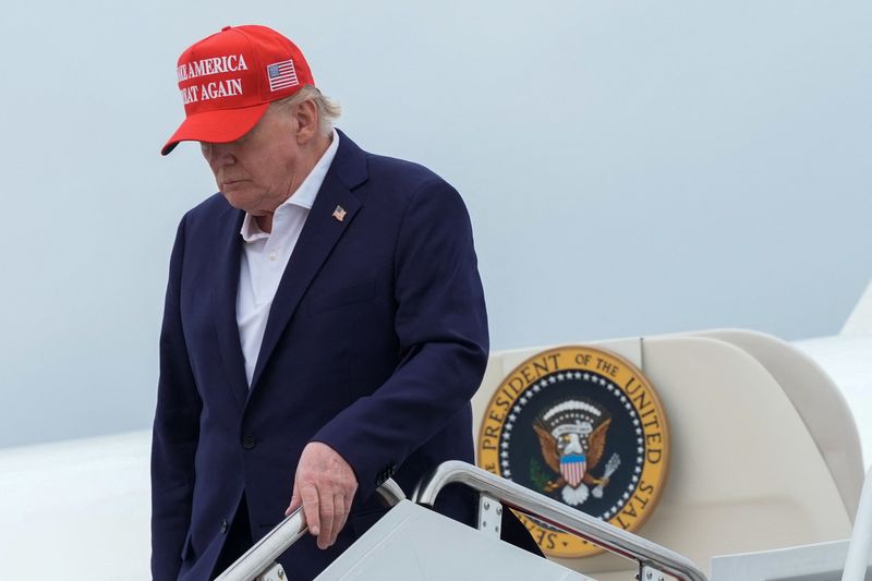 U.S. President Donald Trump disembarks Air Force One at Joint Base Andrews, Maryland, U.S., August 16, 2026. REUTERS/Ken Cedeno