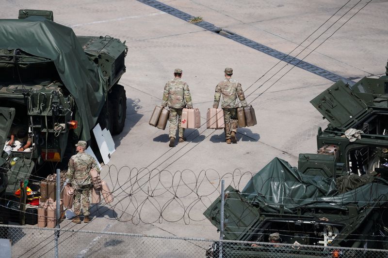U.S. Army soldiers move jerrycans at a U.S. army base near the demilitarized zone separating two Koreas, in Dongducheon, South Korea, August 18, 2026.   REUTERS/Kim Hong-Ji