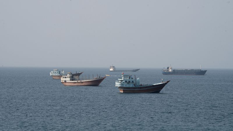 Vessels near the Strait of Hormuz, as seen from Musandam, Oman, August 17, 2026. REUTERS/Stringer