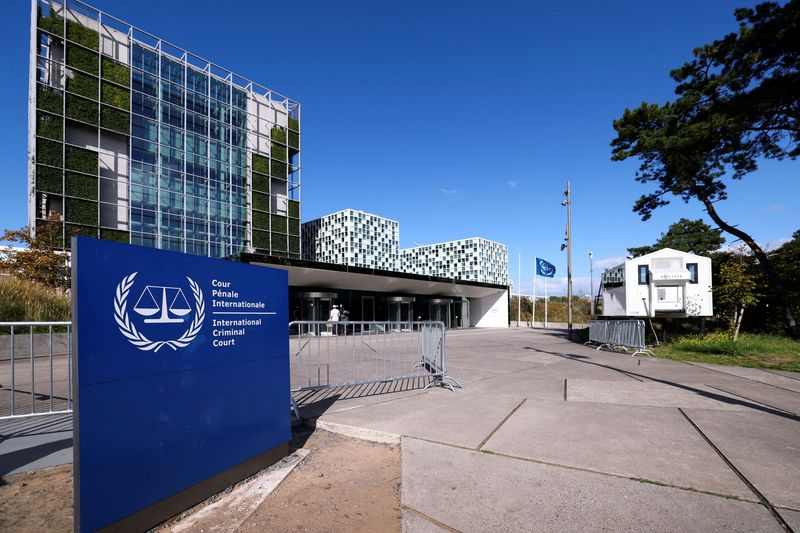 FILE PHOTO: People stand outside the International Criminal Court in the Hague, Netherlands, September 22, 2025. REUTERS/Piroschka van de Wouw/File Photo