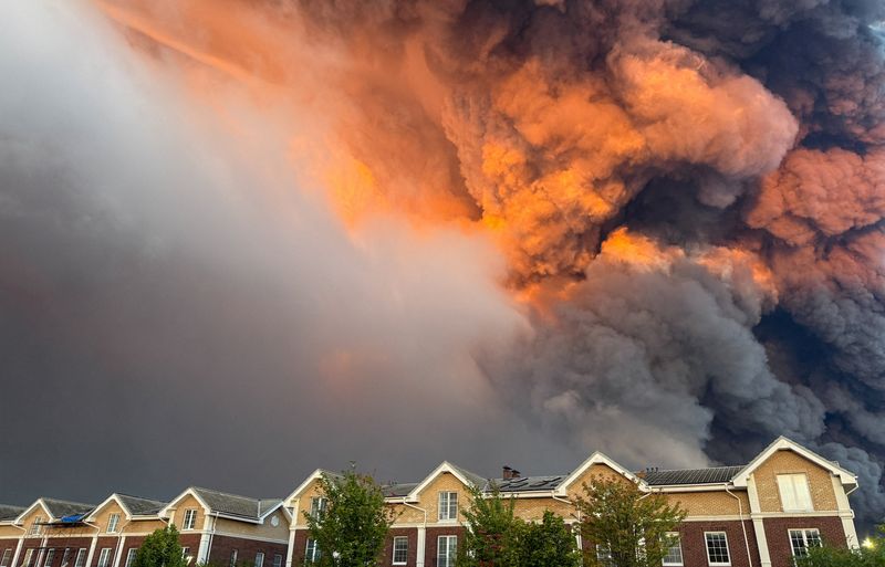 Smoke billows from the burning Wildberries warehouses following a Ukrainian drone attack, according to the regional governor, in the course of the Russia-Ukraine conflict, in Koledino, Moscow Region, Russia August 16, 2026. Picture taken with mobile phone. REUTERS/Stringer