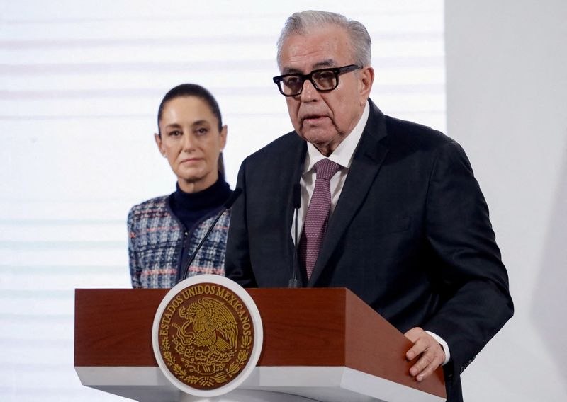 FILE PHOTO: Sinaloa Governor Ruben Rocha speaks to the media during a press conference next to Mexican President Claudia Sheinbaum at the National Palace, in Mexico City, Mexico, June 26, 2025. REUTERS/Luis Barro/File Photo