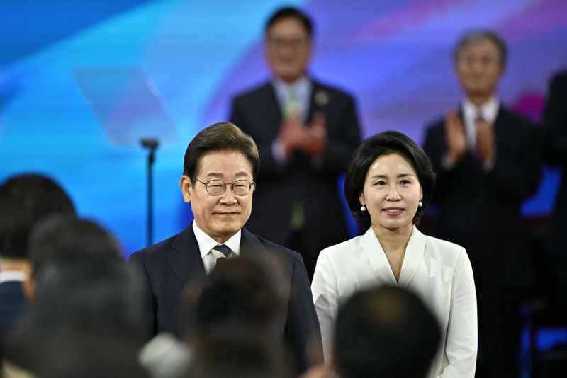 South Korea's President Lee Jae-myung (L) and his wife Kim Hye-kyung arrive for his inauguration ceremony at the National Assembly in Seoul on June 4, 2025.     ANTHONY WALLACE/Pool via REUTERS