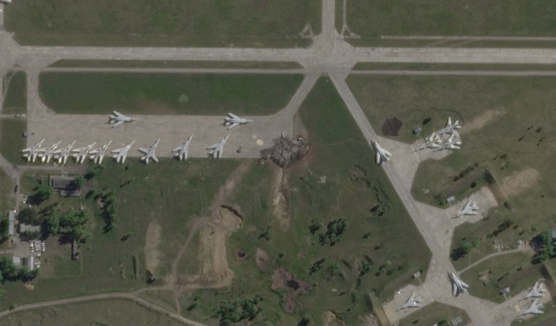 A satellite view shows military aircraft, some sitting destroyed, at the Belaya air base, near Stepnoy, Irkutsk region, Russia, June 4, 2025, after Ukraine launched a drone attack, dubbed "Operation Spider's Web", targeting Russian strategic bombers during Russia's ongoing invasion of Ukraine. 2025 Planet Labs PBC/Handout via REUTERS