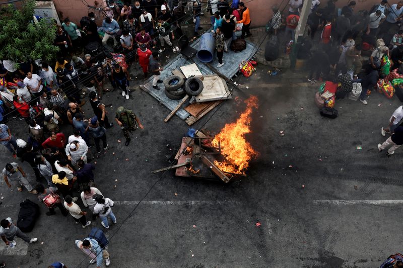 Prisoners burn furniture and other items outside the Dilli Bazaar jail as they try to breakout, following protests against Monday's killing of 19 people after anti-corruption protests triggered by a social media ban which was later lifted, in Kathmandu, Nepal, September 10, 2025. REUTERS/Navesh Chitrakar
