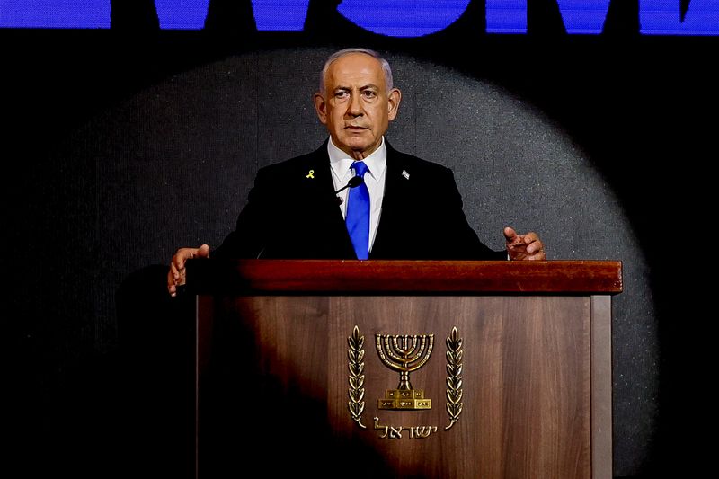 FILE PHOTO: Israeli Prime Minister Benjamin Netanyahu attends the U.S. Independence Day reception, known as the annual "Fourth of July" celebration, hosted by Newsmax, in Jerusalem August 13, 2025. REUTERS/Ronen Zvulun/Pool/File Photo