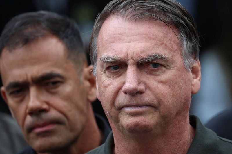 Former Brazilian President Jair Bolsonaro leaves the hospital where he went to undergo a skin surgery procedure, authorized by Supreme Court Justice Alexandre de Moraes, leaving the house arrest after being convicted by a Supreme Court majority of plotting a coup to remain in power after losing the 2022 election, in Brasilia, Brazil, September 14, 2025. REUTERS/Adriano Machado