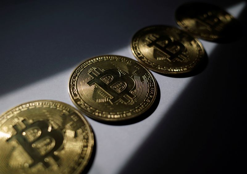 FILE PHOTO: A representation of the virtual cryptocurrency Bitcoin is seen in this picture illustration taken October 19, 2021. REUTERS/Edgar Su/File Photo