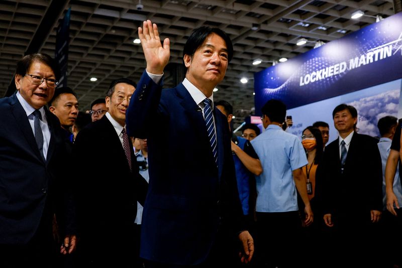 FILE PHOTO: Taiwan's President Lai Ching-te waves as he visits the Taipei Aerospace and Defence Technology Exhibition in Taipei, Taiwan, September 19, 2025. REUTERS/Ann Wang/File Photo