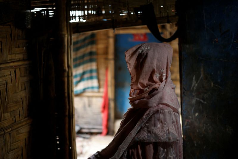 Ajib Bahar, 38, a newly-arrived Rohingya refugee poses for a picture inside her shelter at a refugee camp in Cox's Bazar, Bangladesh, August 27, 2025. REUTERS/Mohammad Ponir Hossain