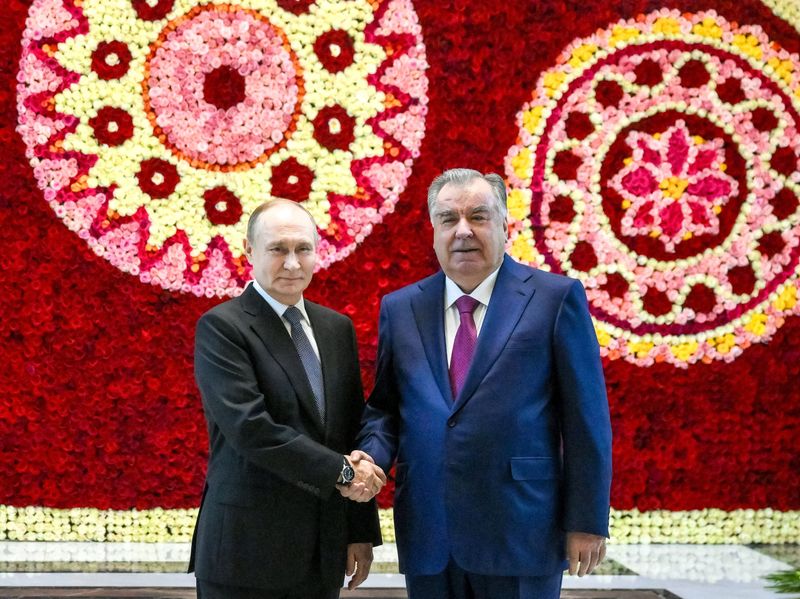 Russian President Vladimir Putin shakes hands with Tajik President Emomali Rahmon during a meeting in Dushanbe, Tajikistan October 8, 2025. Sputnik/Grigory Sysoev/Pool via REUTERS ATTENTION EDITORS - THIS IMAGE WAS PROVIDED BY A THIRD PARTY.
