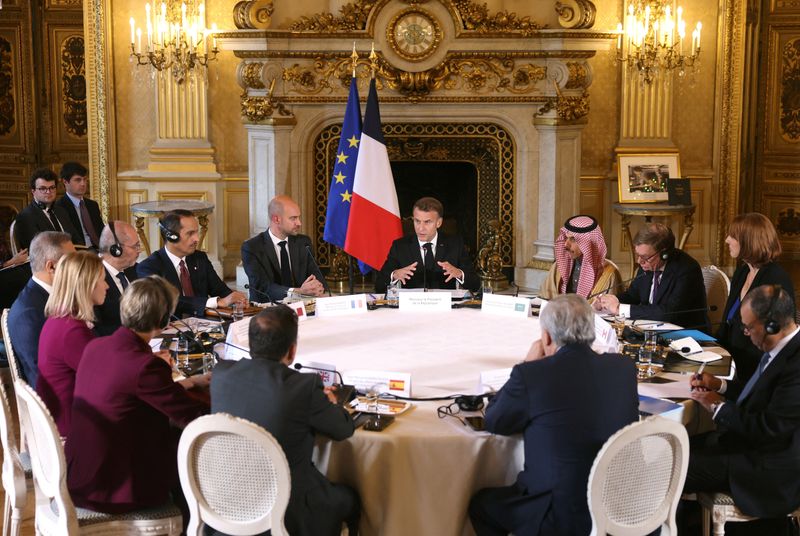 France's President Emmanuel Macron, next to Minister for Europe and Foreign Affairs Jean-Noel Barrot and Saudi Foreign Minister Prince Faisal bin Farhan Al Saud, speaks during a ministerial meeting on the implementation of the Middle East peace plan at the Quai d'Orsay, in Paris, France October 9, 2025. Thomas Samson/Pool via REUTERS