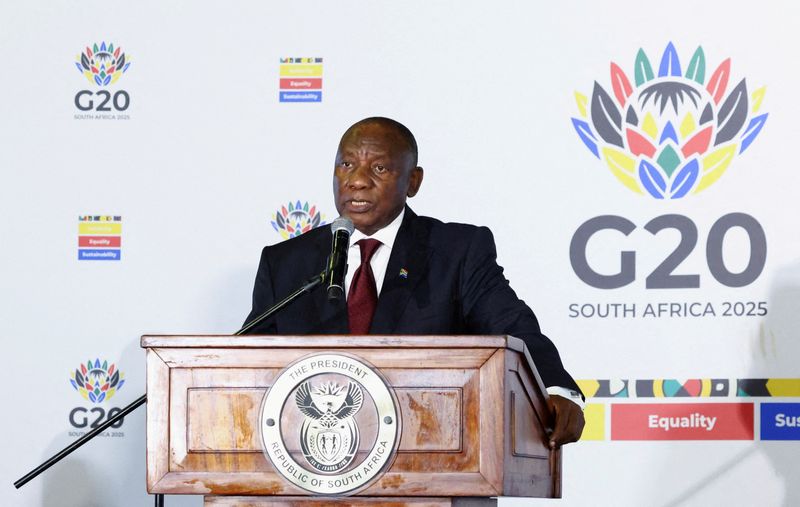 South African President Cyril Ramaphosa speaks to members of the media on the sidelines of the meeting of the G20 foreign ministers, which is hosted by South Africa under the theme "Solidarity, Equality and Sustainability", at the NASREC conference centre in Johannesburg, South Africa, February 20, 2025. REUTERS/Siphiwe Sibeko