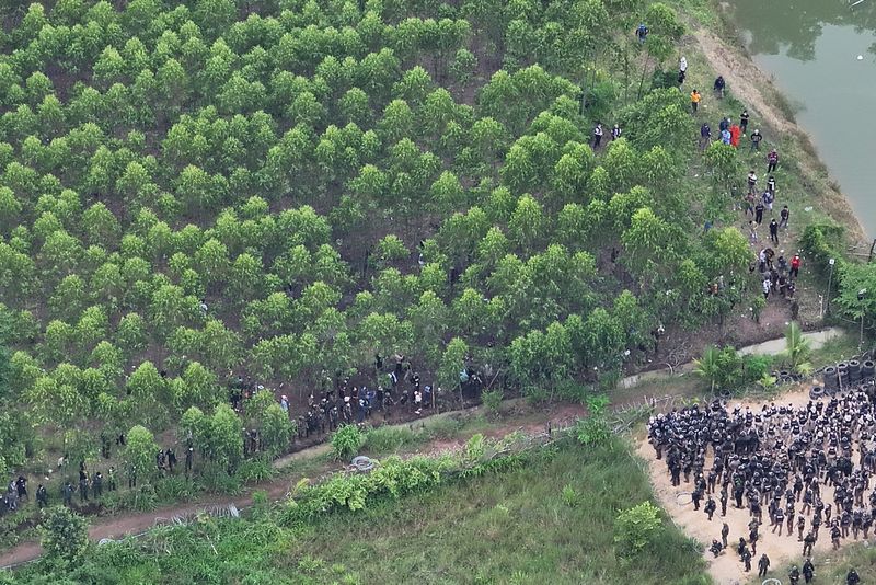 A drone view shows Thai soldiers and riot police officers confronting Cambodian people in a disputed village along the Thailand-Cambodia border in Sa Kaeo province, Thailand, September 17. via Royal Thai Army