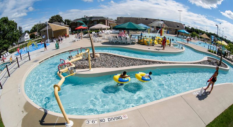Two youngsters float along on tubes at The Manitowoc Family Aquatic Center, Wednesday, July 20, 2022, in Manitowoc, Wis.