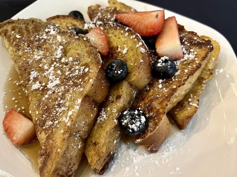 The French toast at Singing Salmon Saloon in Port Washington has a silky center. It's served with fresh berries and maple syrup.