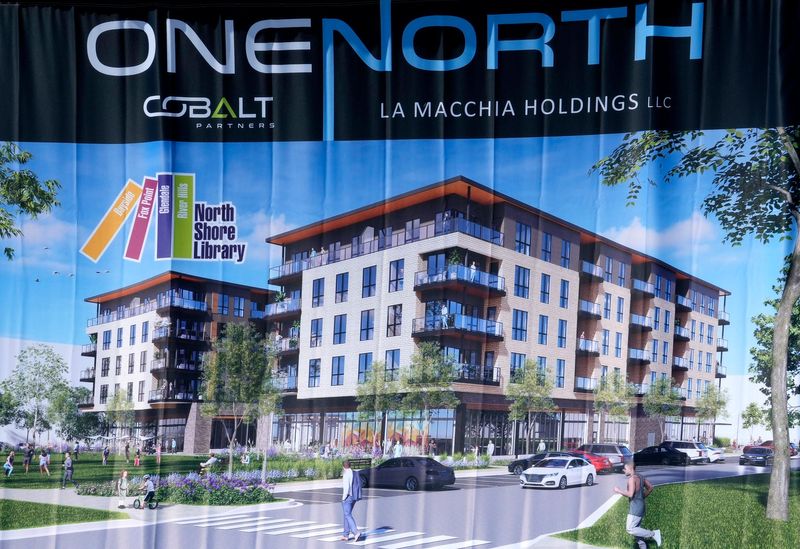 A rendering of the  OneNorth development is on display as part of the groundbreaking ceremony of the OneNorth development in Bayside on Wednesday, May 10, 2023. The project, north of West Brown Deer Road between I-43 and North Port Washington Road, is to include apartments, retail and a new home for the North Shore Library.