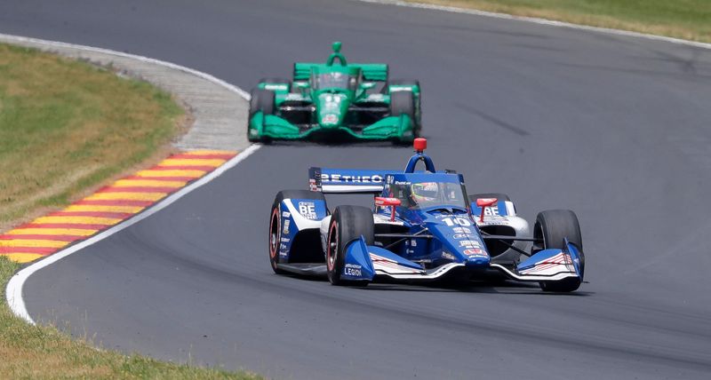 Alex Palou (10) leads Marcus Armstrong (11) through the Mitchell Bend during the Sonsio Grand Prix, Sunday, June 18, 2023, at Elkhart Lake’s Road America near Plymouth, Wis.